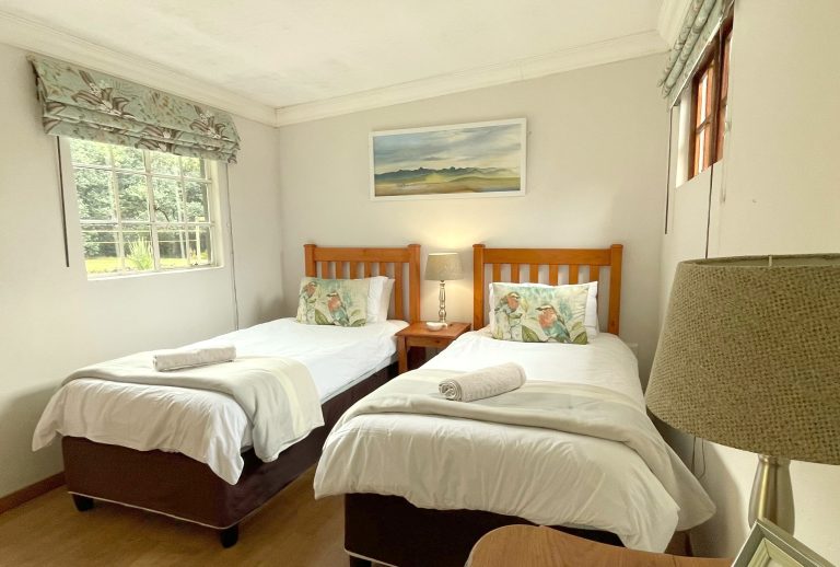 Image showing a twin room with two single beds in a sunlit room to illustrate available Kamberg accommodation